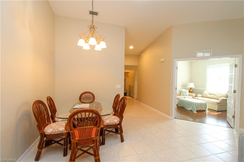Dining area with an inviting chandelier