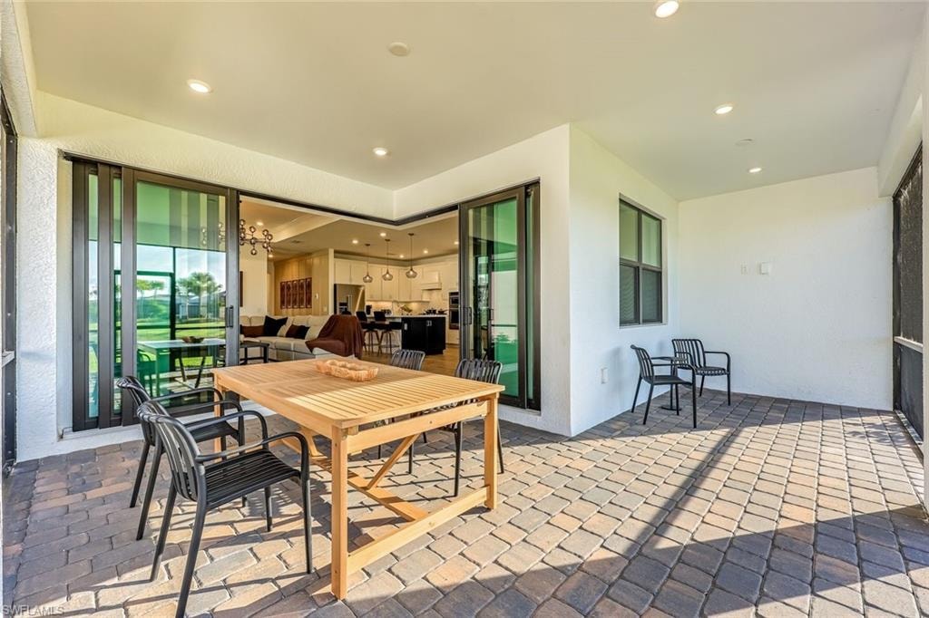 View of patio with outdoor dining space