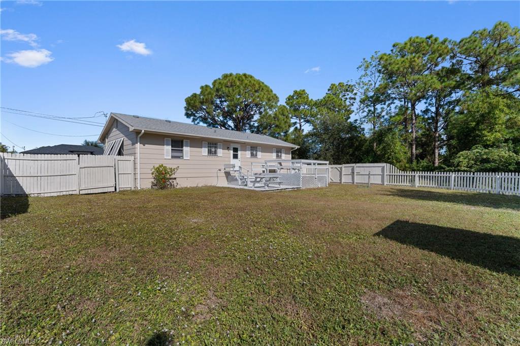 Back of property with a patio and a fenced backyard