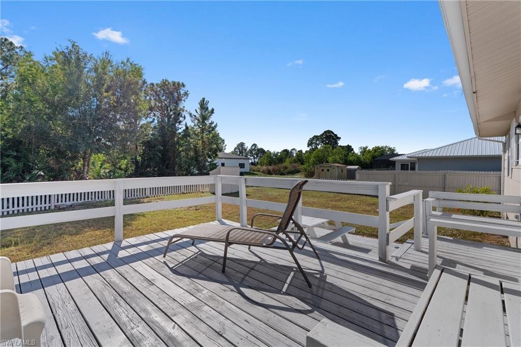 Wooden terrace featuring a fenced backyard