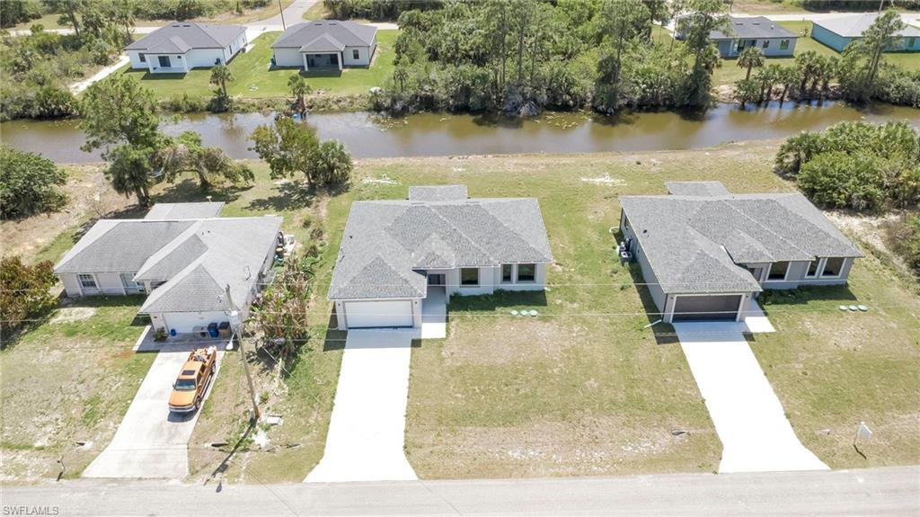 Aerial view of residential area with a nearby body of water