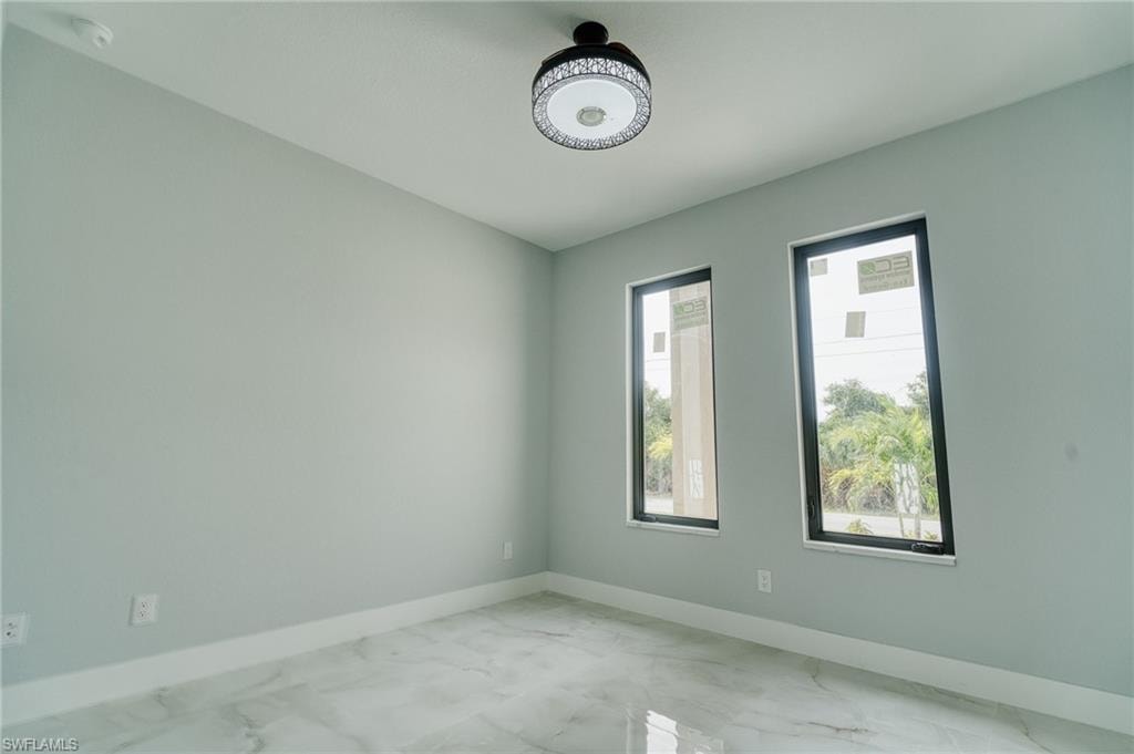 Unfurnished room with marble finish flooring