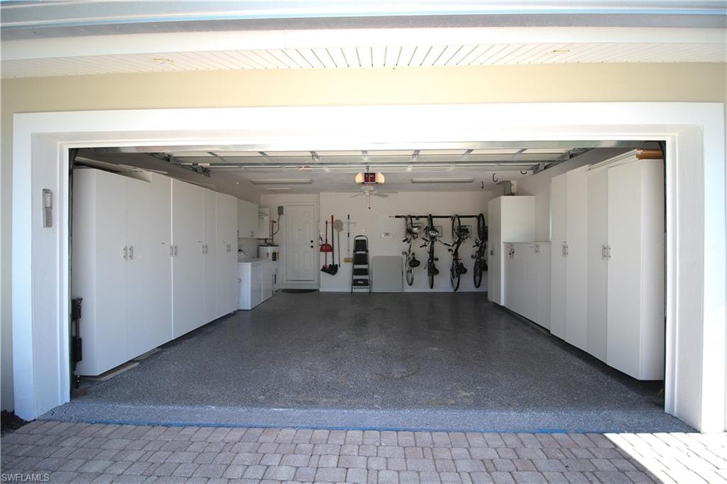 Garage featuring washing machine and dryer