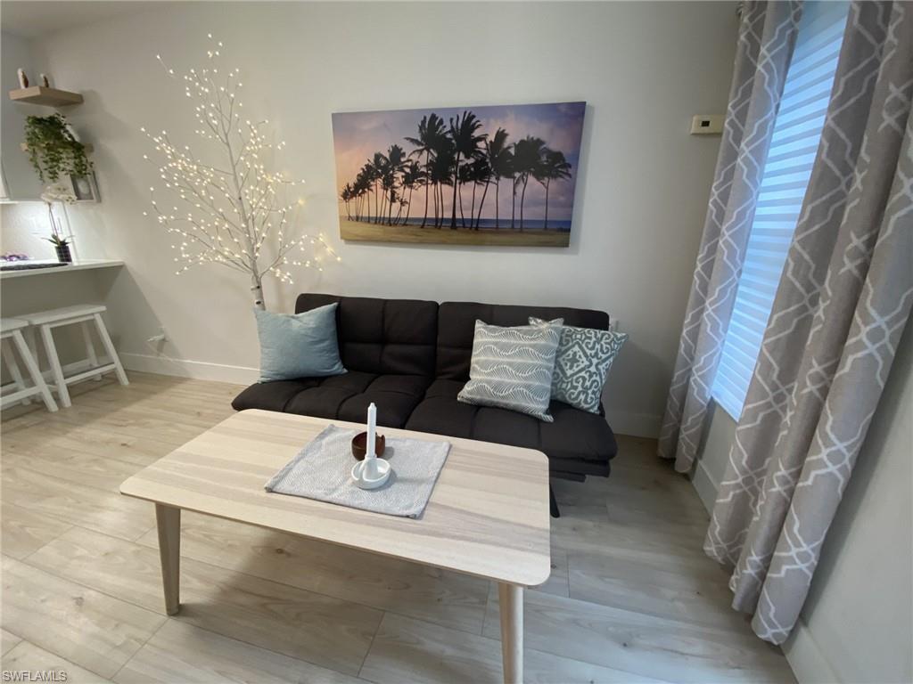 1st floor Living room featuring baseboards and wood finished floors