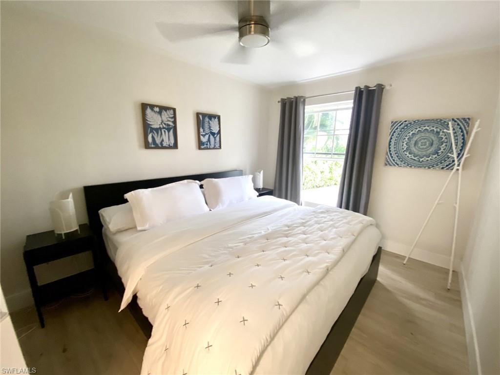 1st floor Bedroom with wood finished floors and a ceiling fan