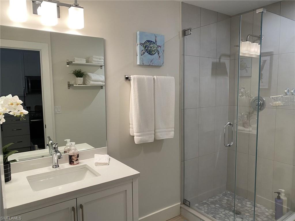 1st floor Full bathroom featuring vanity and a shower stall