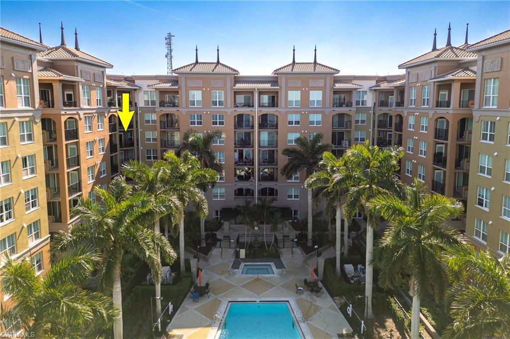 View of apartment building / complex with a community pool