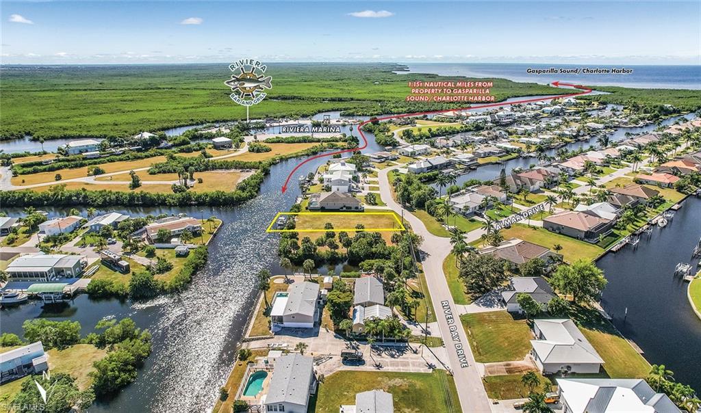 Aerial perspective of suburban area featuring a large body of water