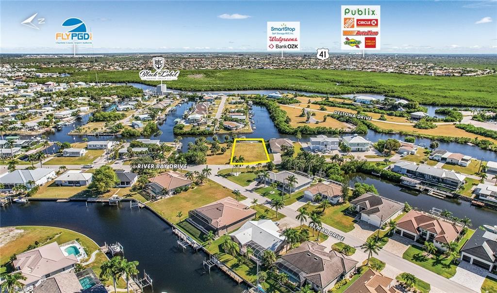 Aerial view of residential area featuring a large body of water