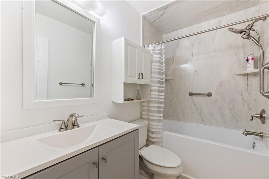Full bathroom with vanity and shower / bath combo