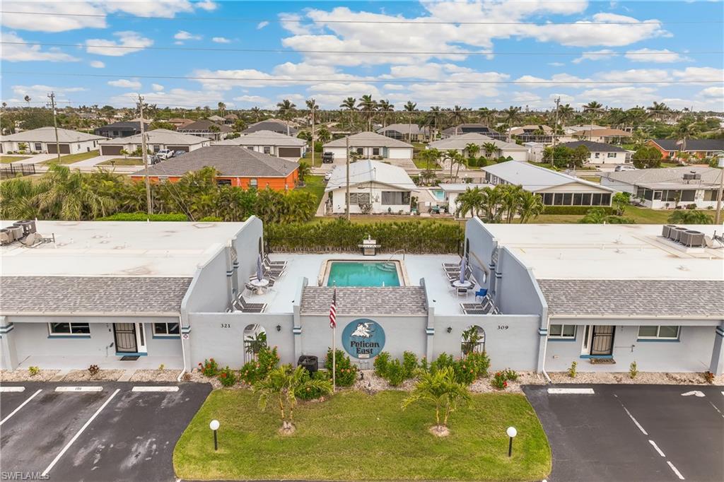 Aerial perspective of suburban area with a pool area