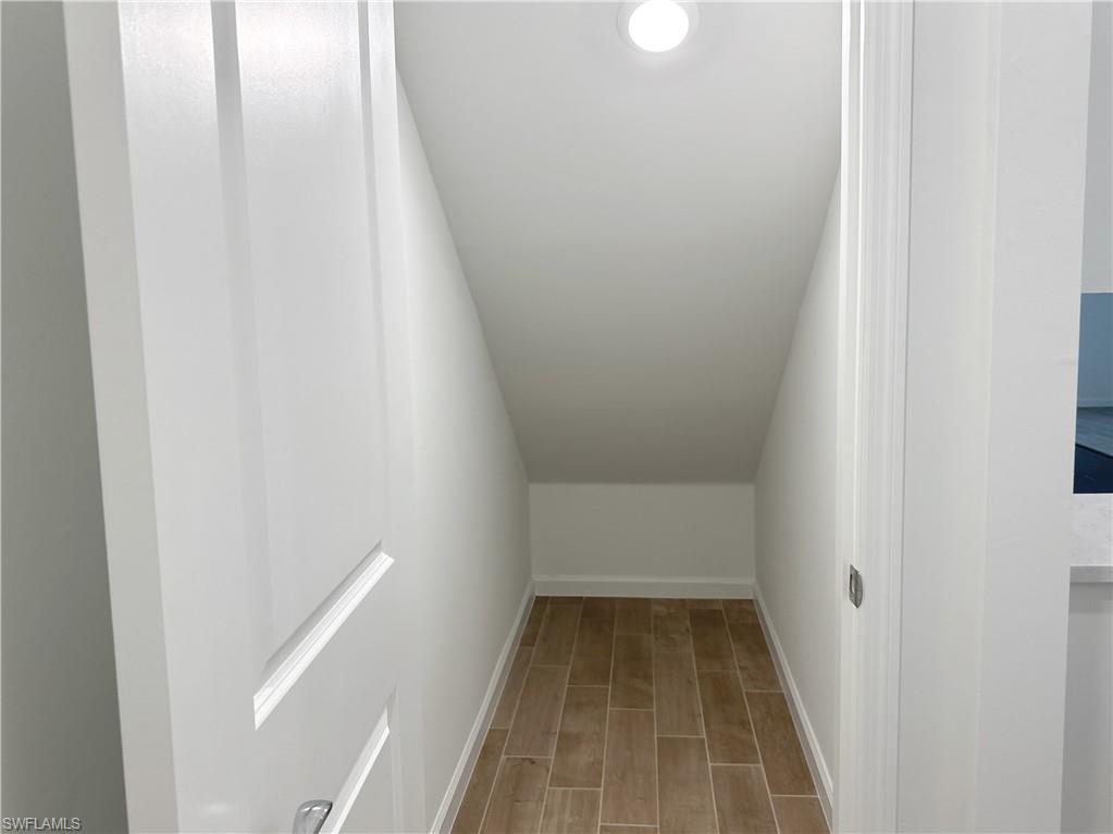 View of storage room under stairs