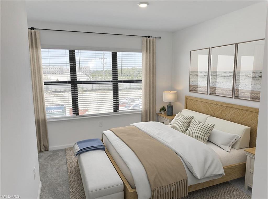 Virtually staged spare room featuring light carpet and baseboards