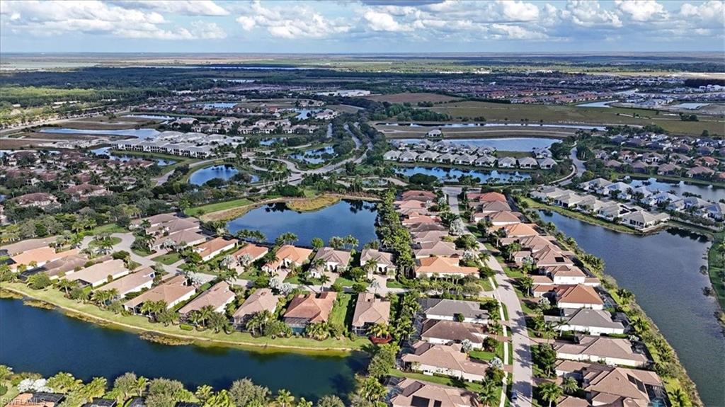 Aerial overview of property's location featuring nearby suburban area
