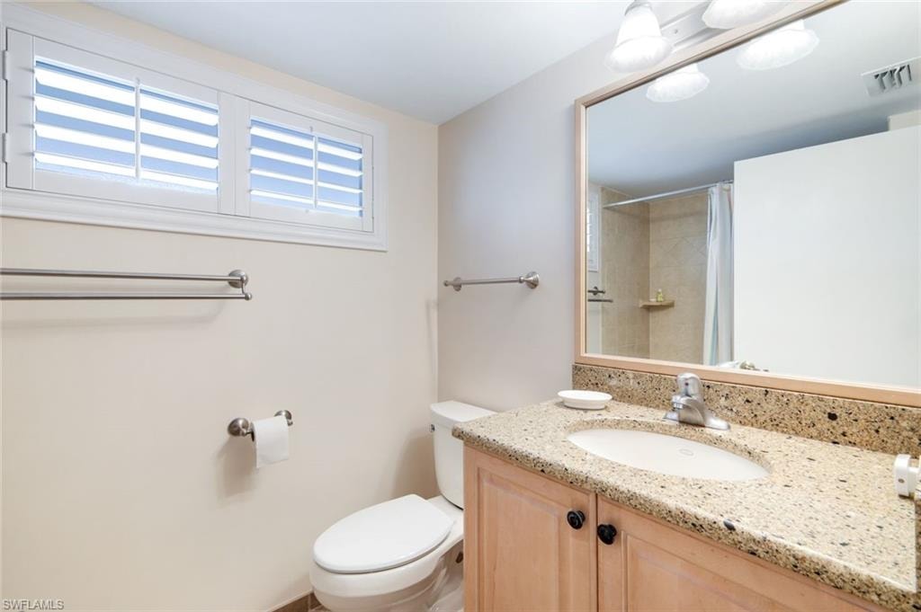 Bathroom featuring vanity and a shower with curtain