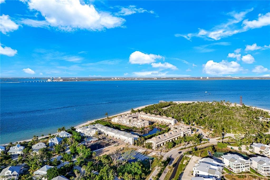 Aerial view of residential area featuring a large body of water