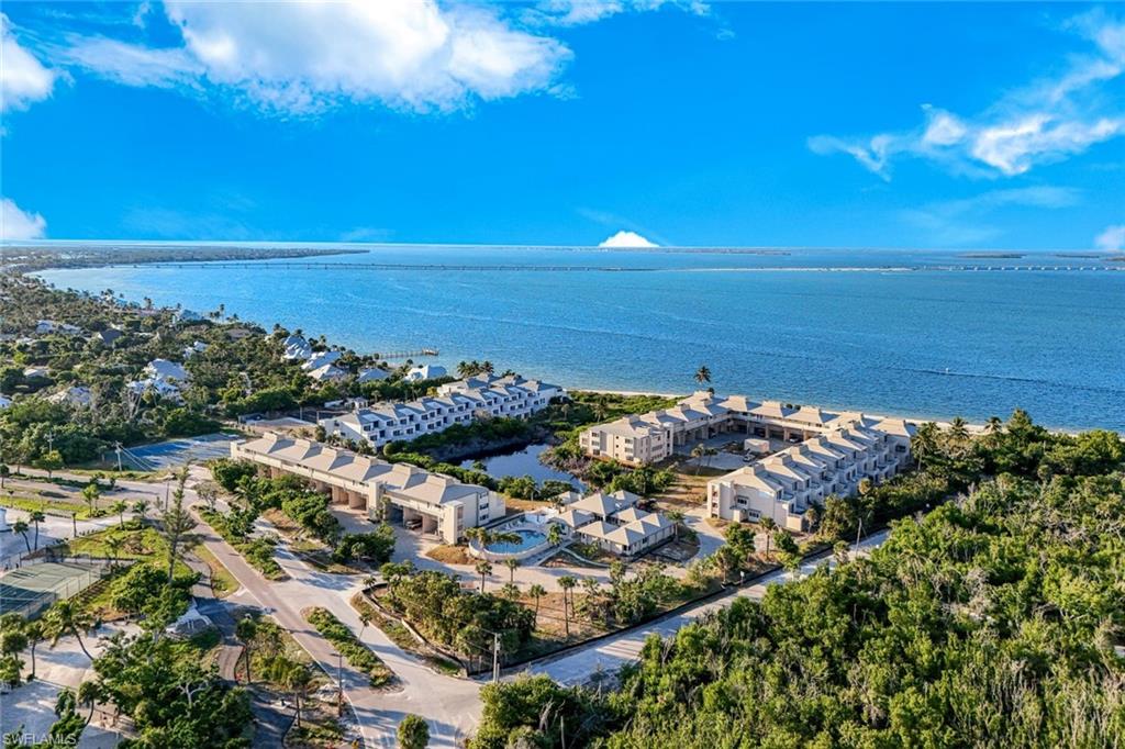 Aerial view of apartment complex and a large body of water