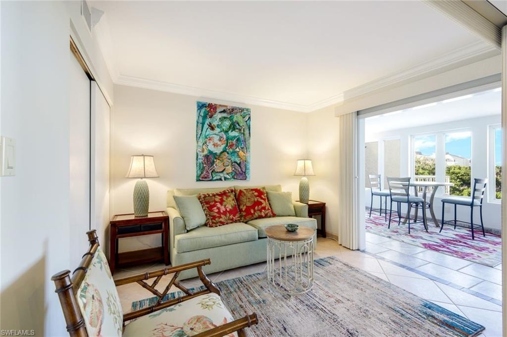 Tiled living room with crown molding