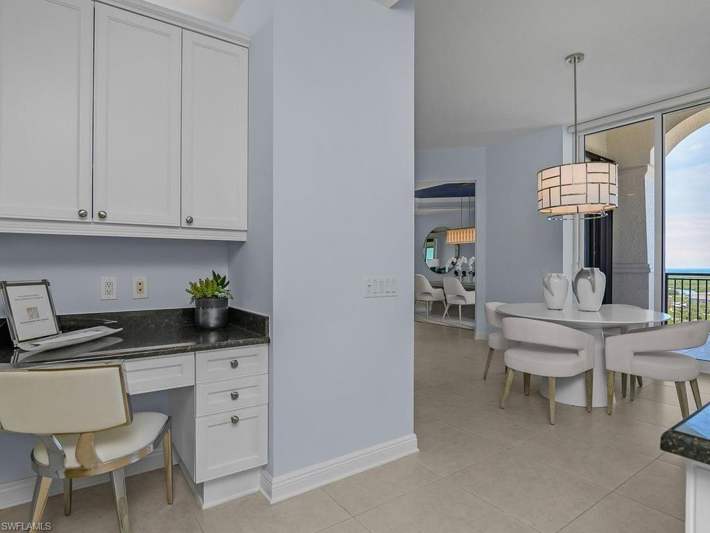 Office desk area adjacent to kitchen
