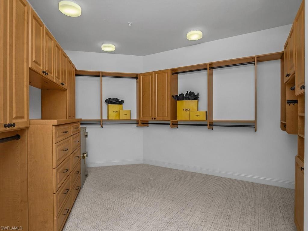 One of two sizable walk-in closets for main bedroom.