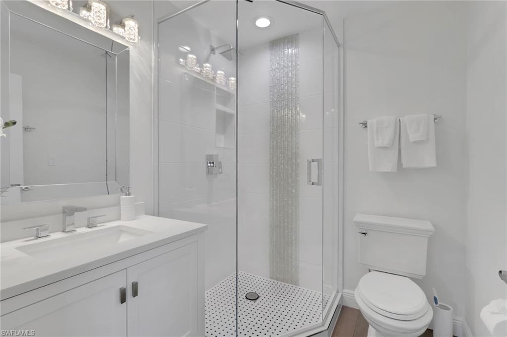 Bathroom with vanity and a stall shower