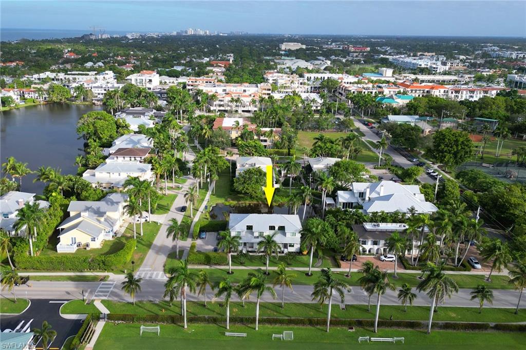 Aerial overview of property's location with a large body of water and nearby urban area