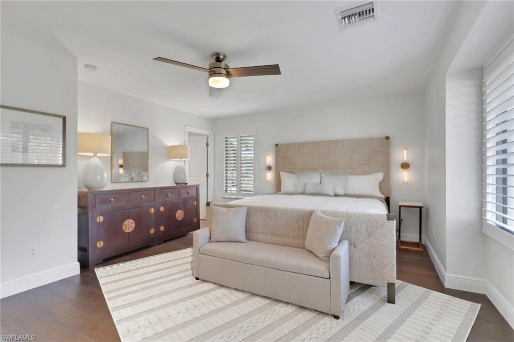 Bedroom featuring a ceiling fan and dark wood-type flooring