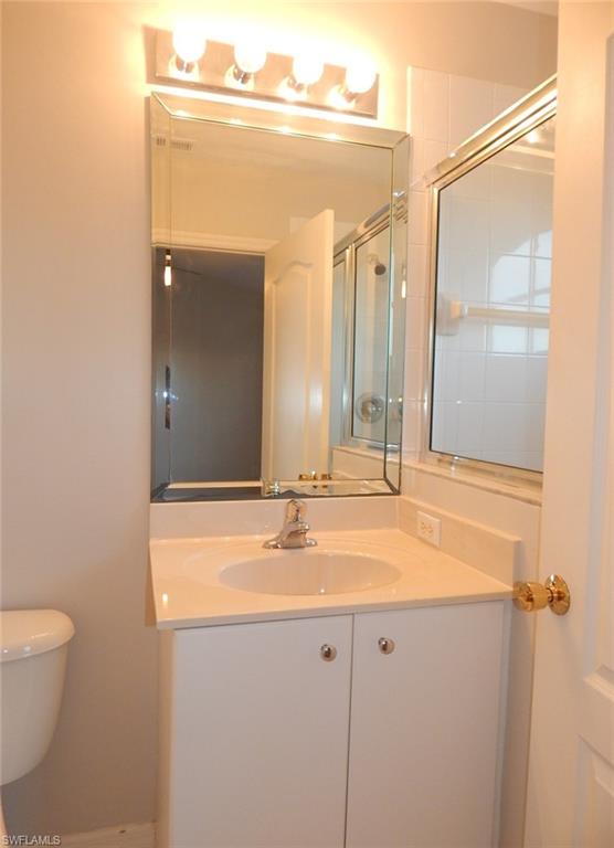 Master bathroom with vanity and a shower with shower door