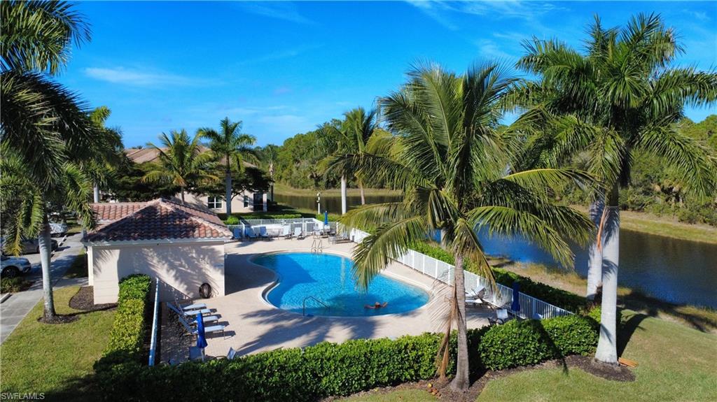 Willows community pool with a patio and a water view