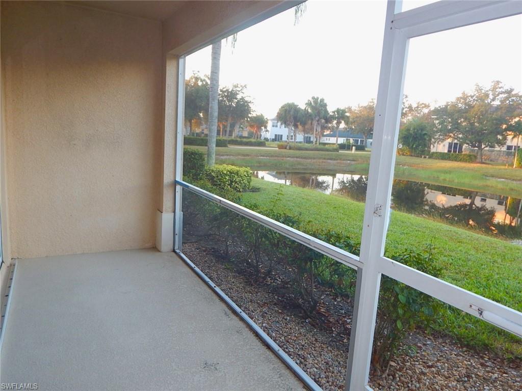 Unfurnished sunroom featuring a water view