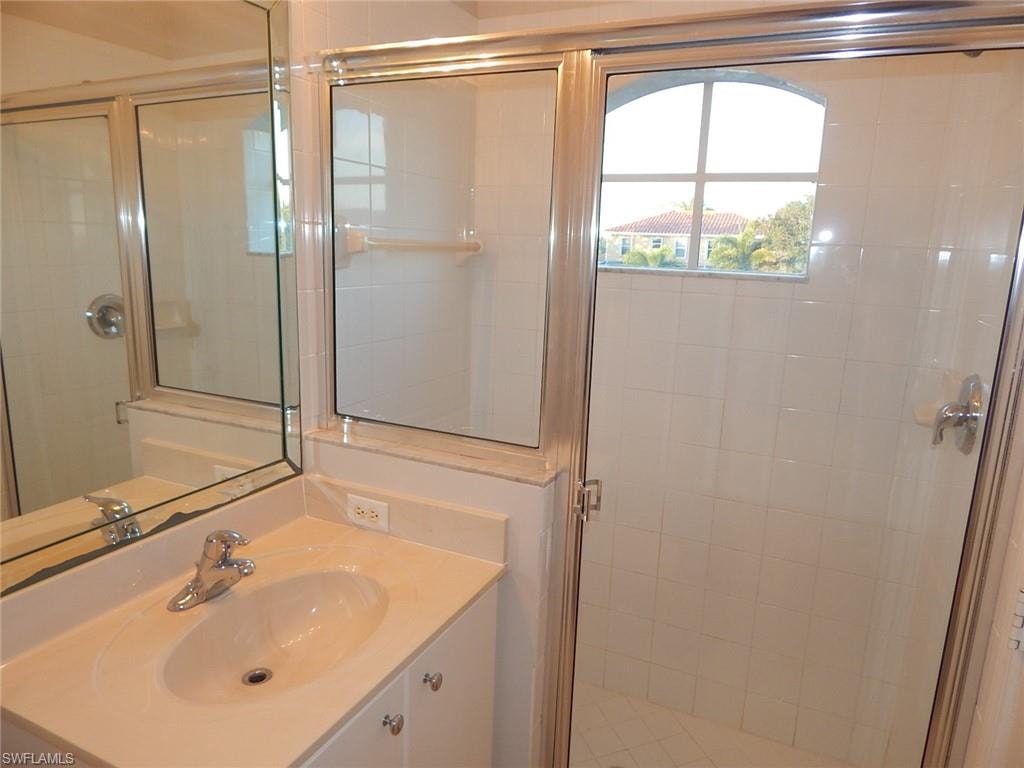 Master bathroom featuring a shower stall and vanity