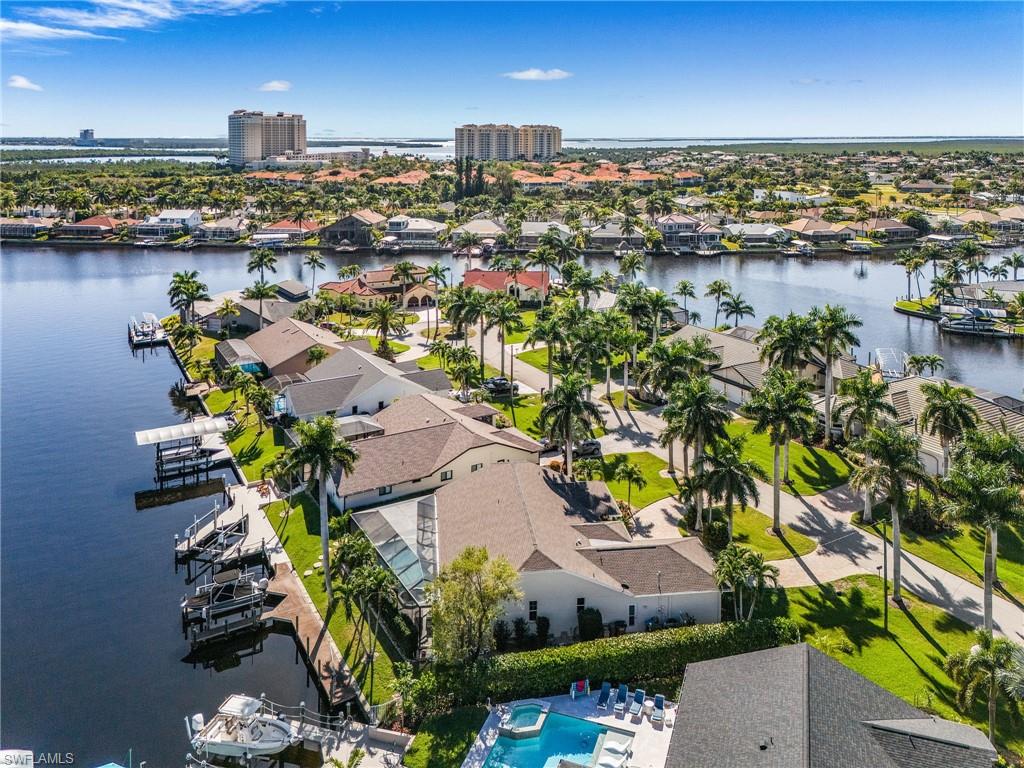 Aerial view of residential area featuring a large body of water
