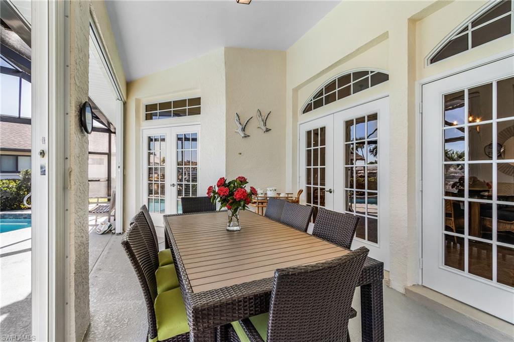 Dining room featuring french doors and a textured wall