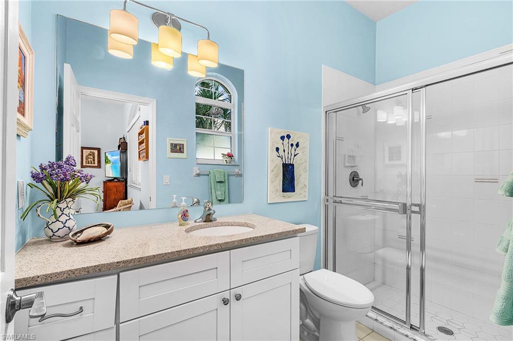 Bathroom with vanity and a stall shower