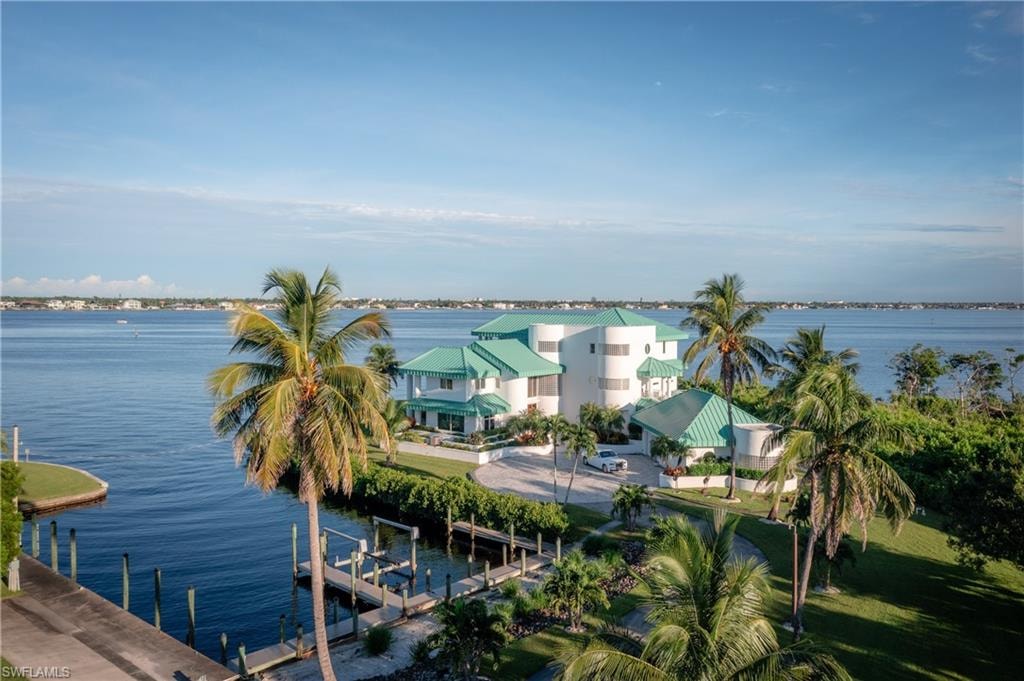 Water view featuring a boat dock and boat lift