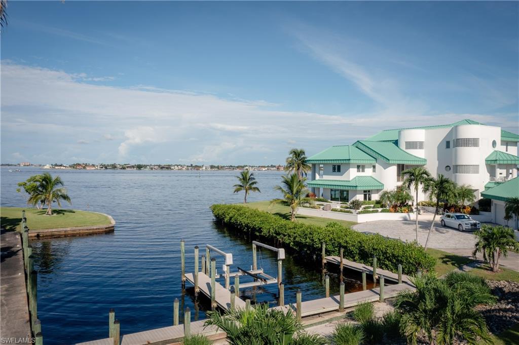 Water view with a dock and boat lift