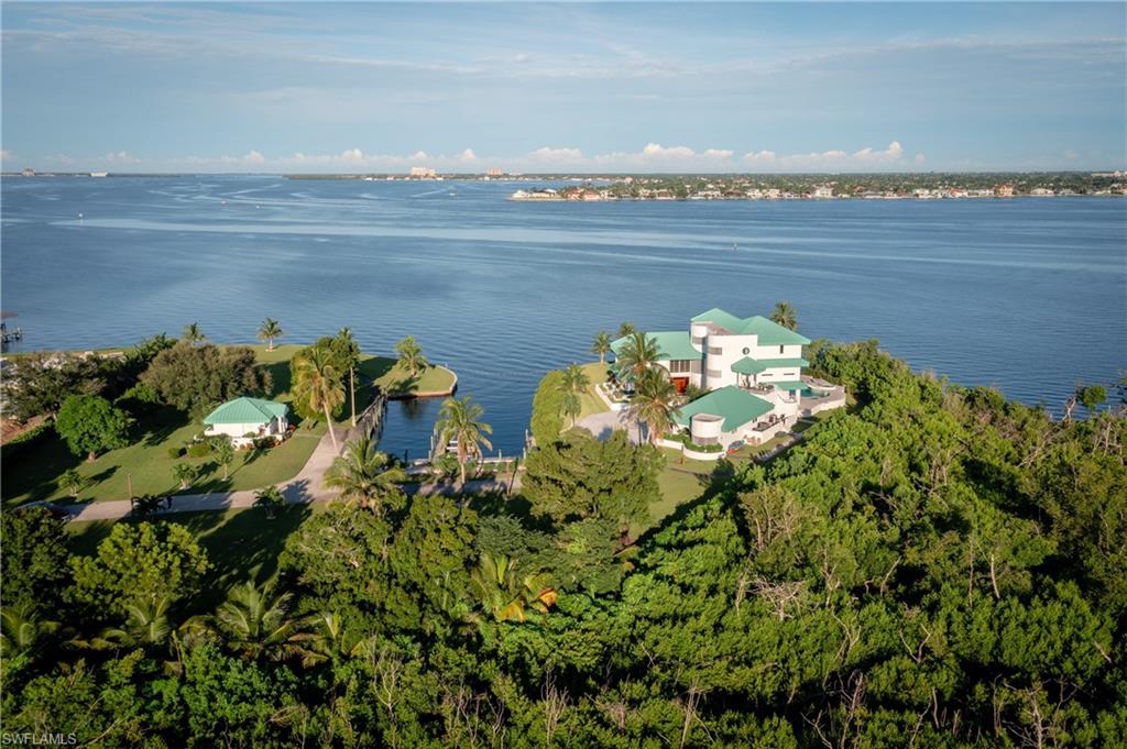 Aerial view of property's location with a nearby body of water