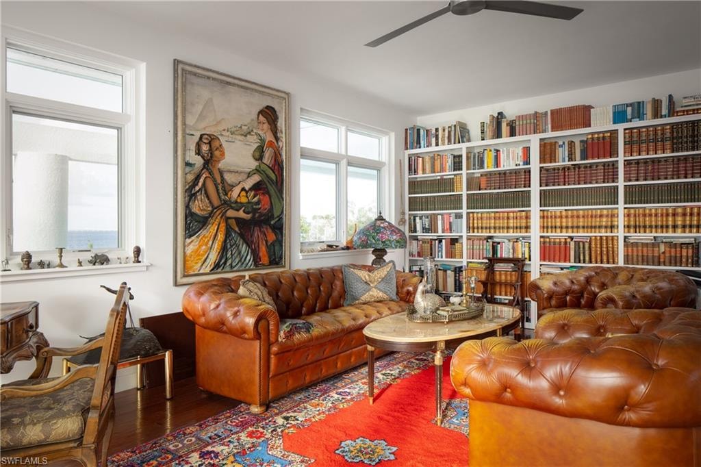 Sitting room featuring wood finished floors and ceiling fan
