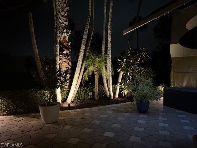Patio at twilight featuring a patio area