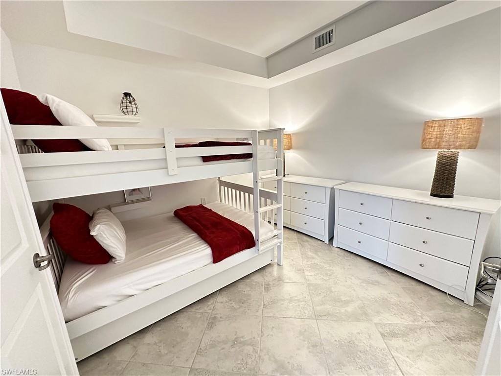 Bedroom featuring light tile patterned floors