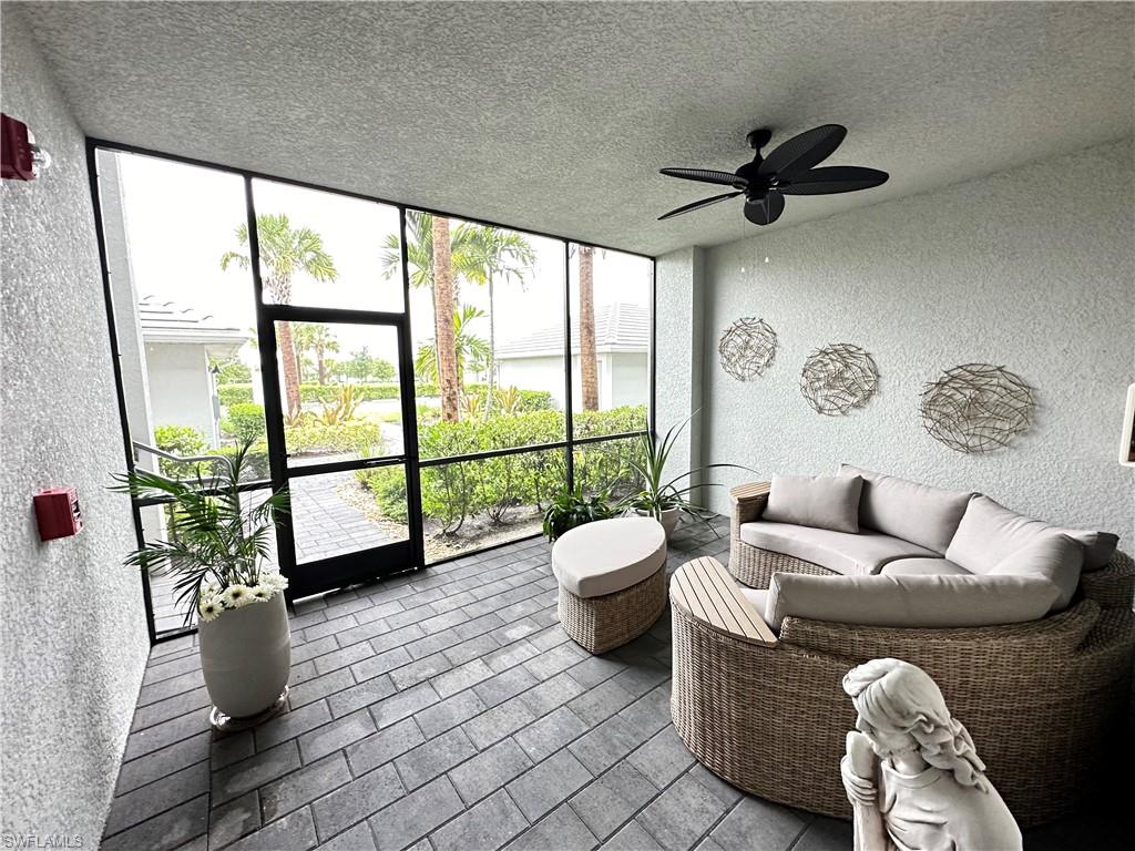 Sunroom / solarium featuring ceiling fan and a wealth of natural light