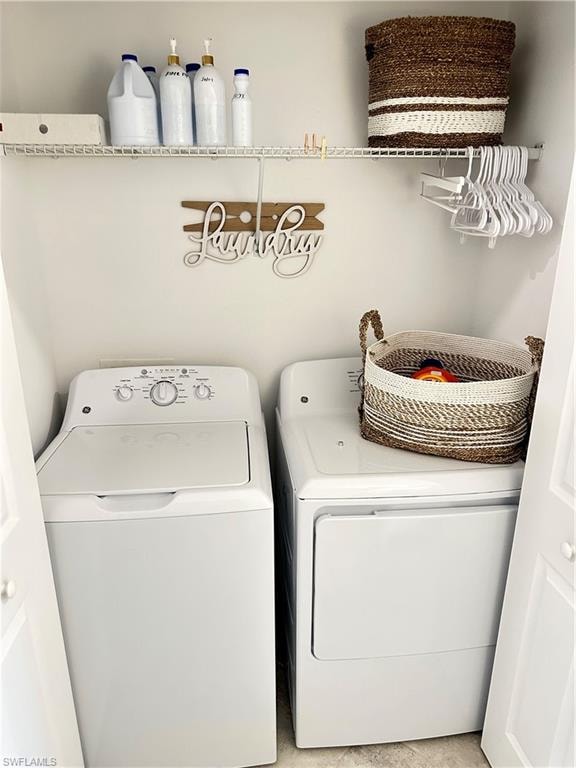 Laundry room featuring separate washer and dryer