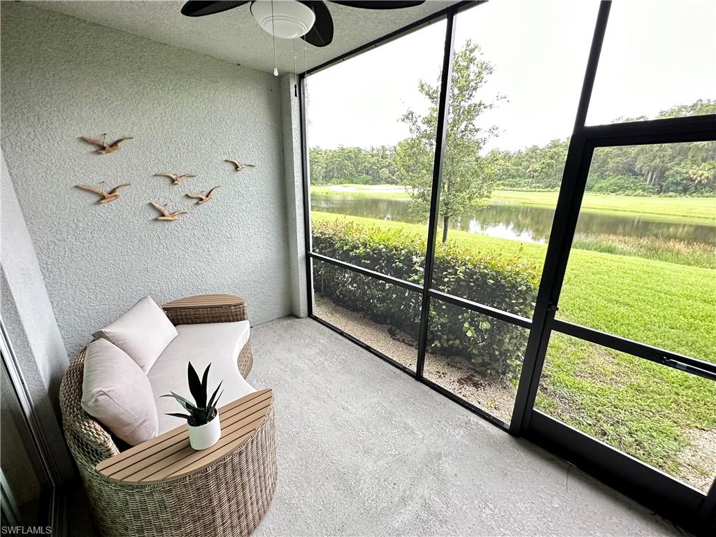 Sunroom / solarium featuring plenty of natural light, a water view, and ceiling fan