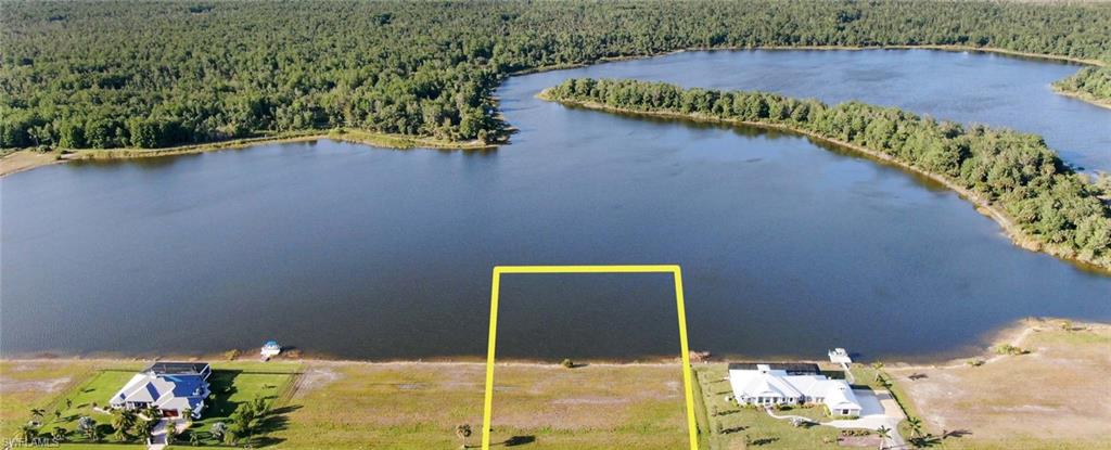 Aerial view of property's location featuring property boundaries highlighted and a nearby body of water