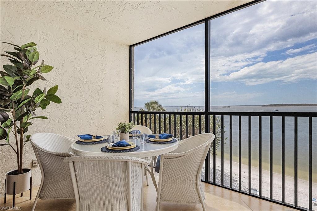 Sunroom with a water view