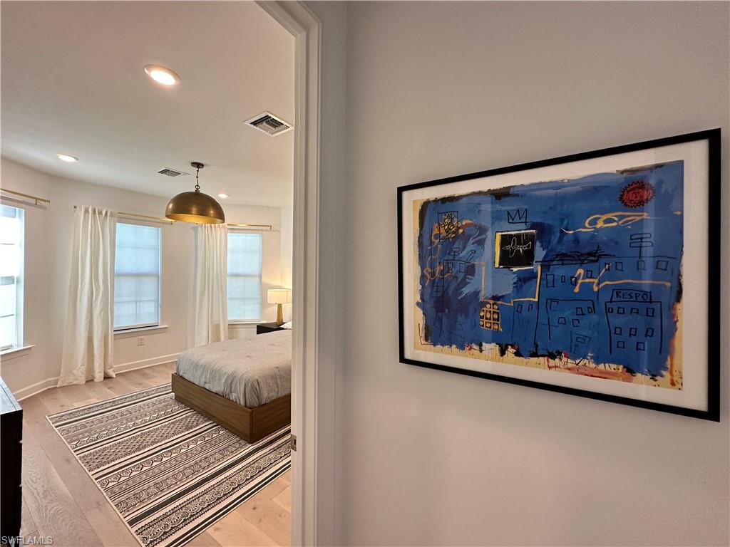 Bedroom with recessed lighting and light wood-style floors