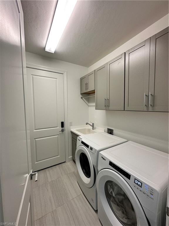 Laundry room with washer and dryer and cabinet space