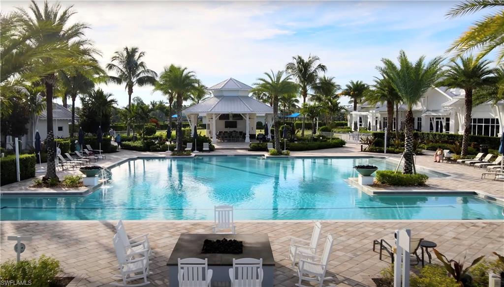 Community pool with a gazebo, a patio, and a fire pit