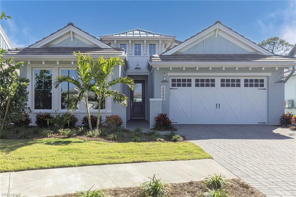 View of front facade with a garage and a front yard