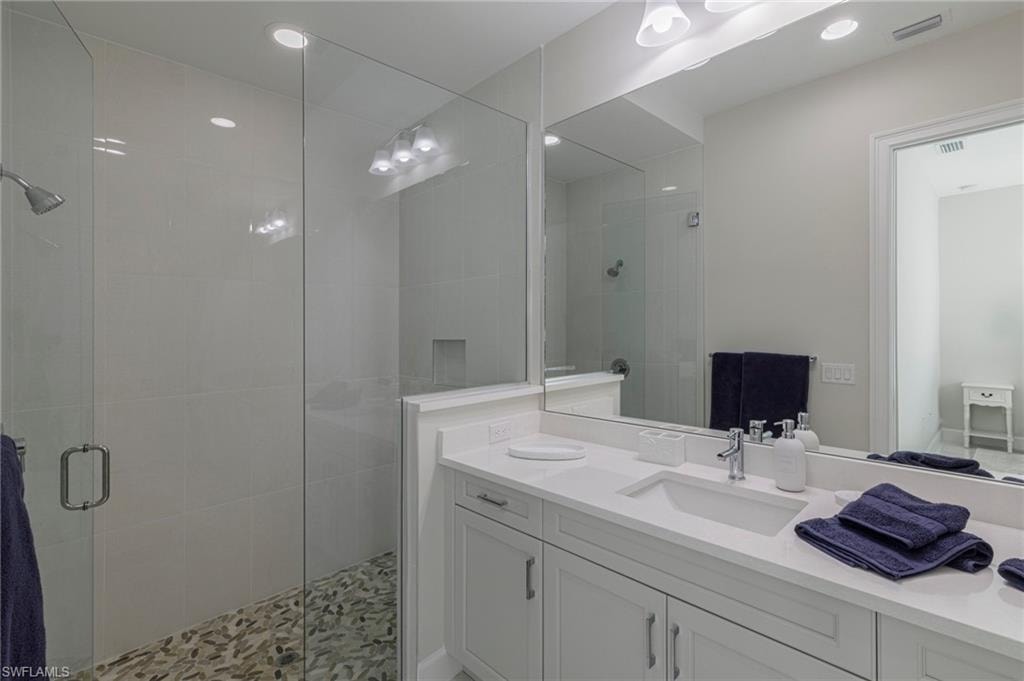 Bathroom featuring vanity and walk in shower